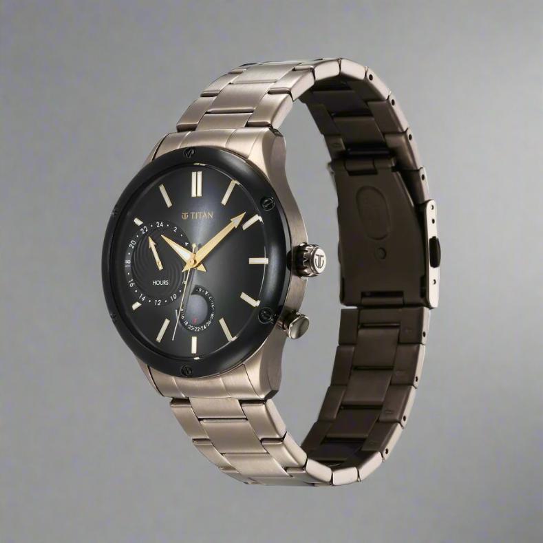 A stylish Titan men's watch featuring a black dial, a durable stainless steel strap, and a bold analog design, perfect for modern elegance and versatile wear.