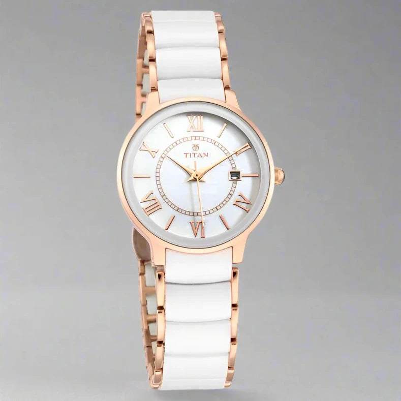 A sophisticated Titan women's watch featuring a gold-tone stainless steel strap, an elegant white dial, and a classic analog design, perfect for timeless style and everyday wear.