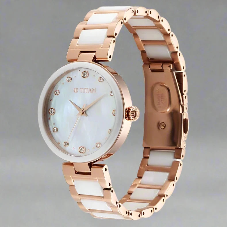 A stylish Titan women's watch with a dual-tone stainless steel strap, a sleek black dial, and an elegant analog design, perfect for both formal and casual occasions