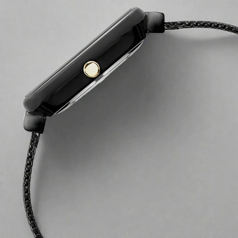 Side Look Of Fastrack FV60012KM01W Vyb Minimalist Quartz Analog Silver Dial Watch with a black stainless steel strap, designed for girls.