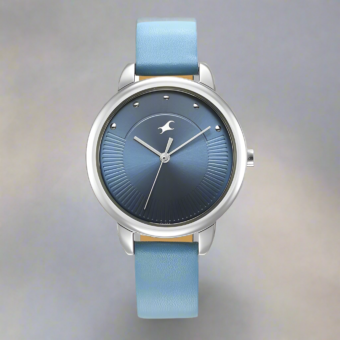 Fastrack NS6282SL01 Stunners Quartz Analog Watch with a blue dial and matching blue leather strap, designed for girls.