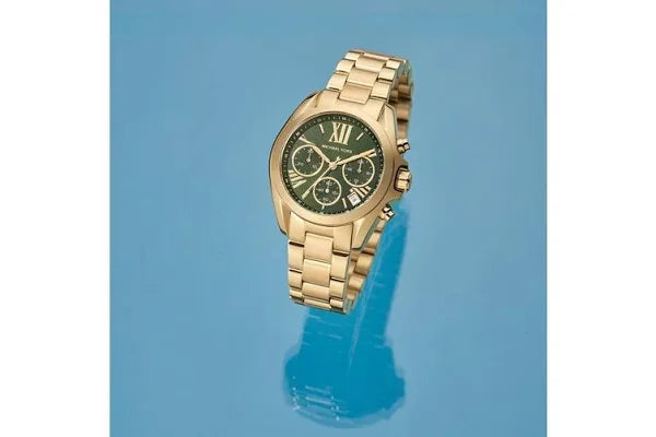 Closeup View Of Michael Kors MK7257 Women's Stainless Steel Analog Green Dial Watch with Gold Band.