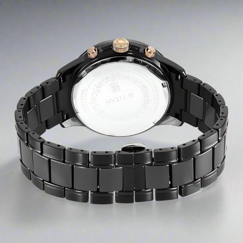 Back View Of Titan NS90090KD03 Quartet Black Dial Analog Watch for Men with Day and Date, featuring a two-toned steel & ceramic strap and a stylish black dial.