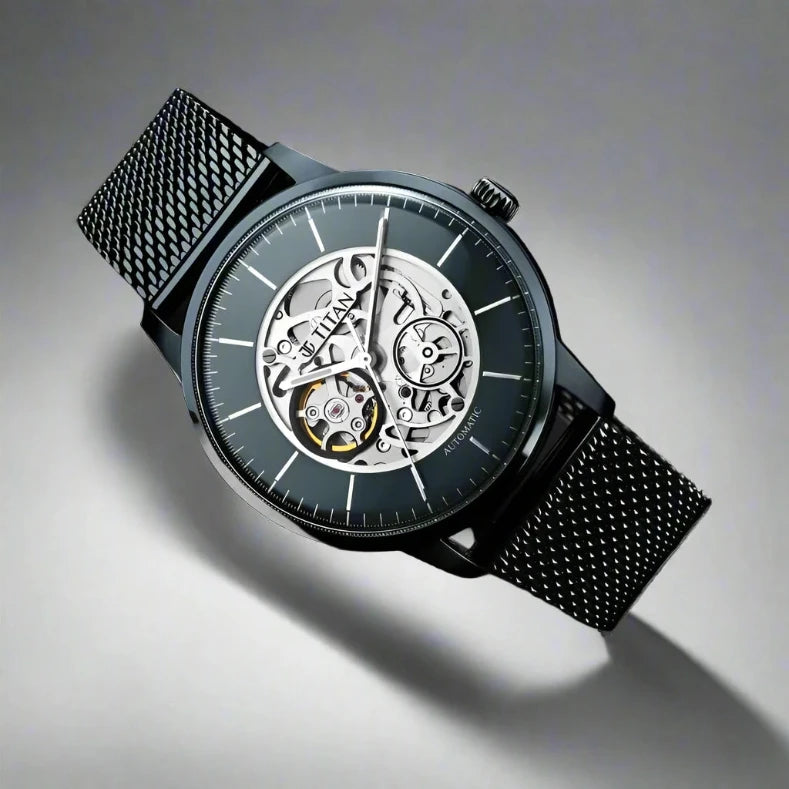 Titan NS90110QM01 Mechanical Blue Dial Automatic Watch for Men with Stainless Steel Strap, featuring an open-heart dial and sleek blue mesh design.