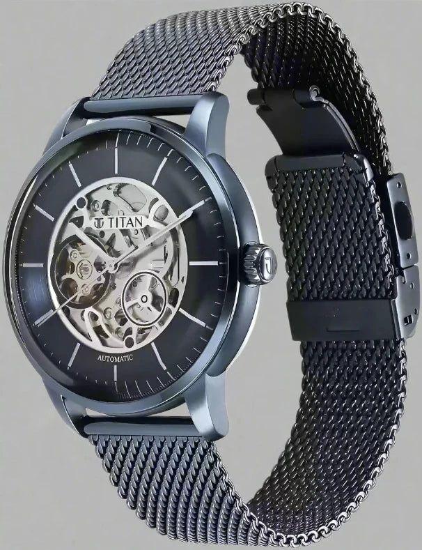 Side View Of Titan NS90110QM01 Mechanical Blue Dial Automatic Watch for Men with Stainless Steel Strap, featuring an open-heart dial and sleek blue mesh design.