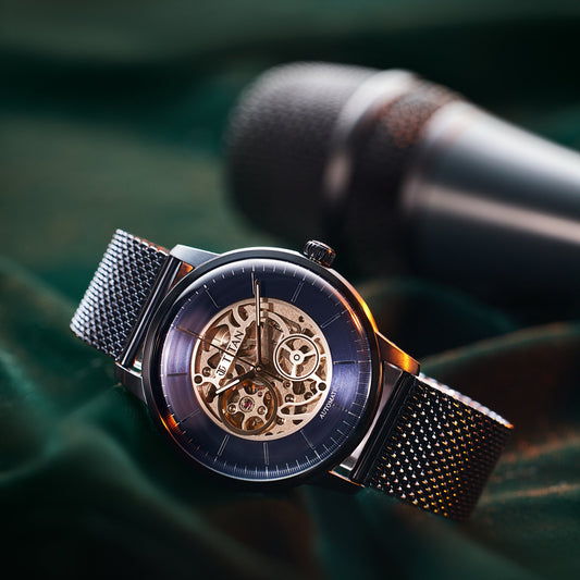 Titan NS90110QM01 Mechanical Blue Dial Automatic Watch for Men with Stainless Steel Strap, featuring an open-heart dial and sleek blue mesh design.