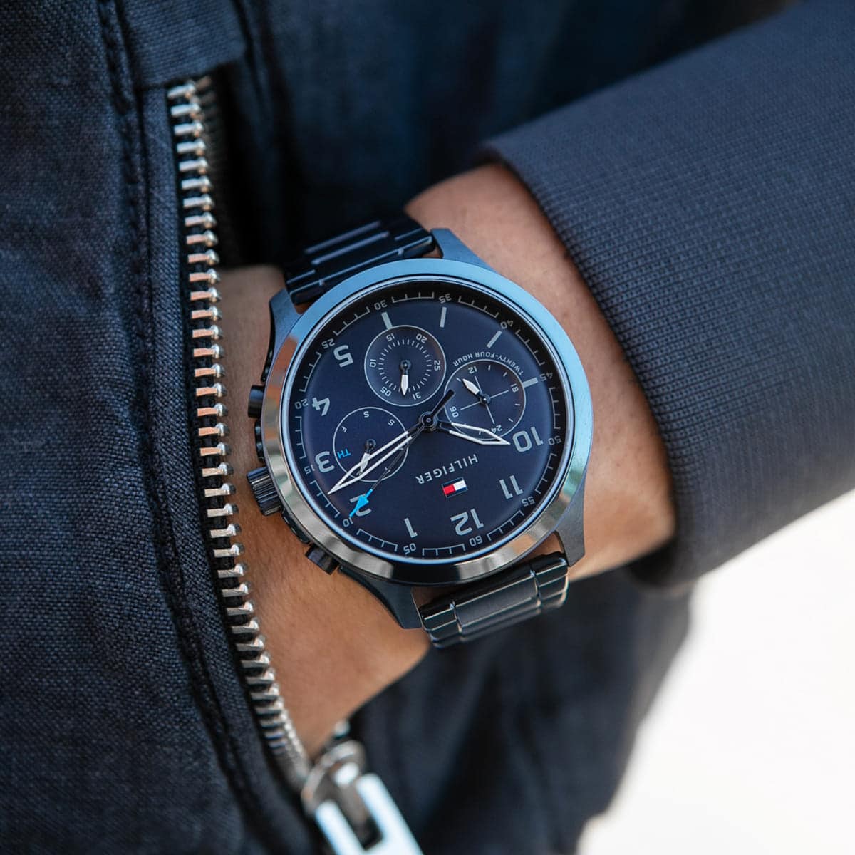 Wearing View Of Tommy Hilfiger 1791853 Men's Watch with Blue Dial, Black Stainless Steel Case, and Silicone Strap