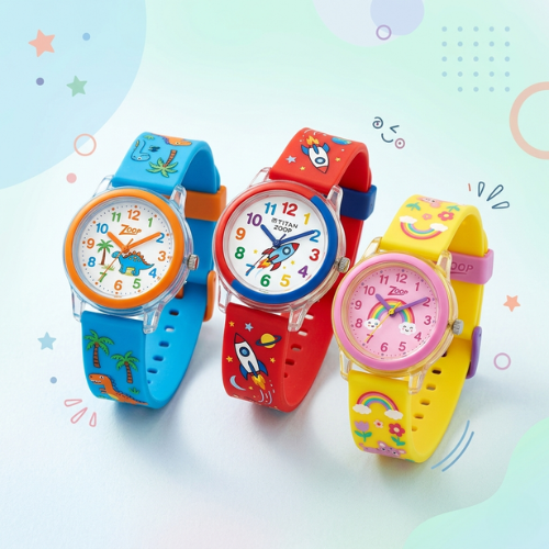 Three colorful Titan Zoop watches for kids with dinosaur, rocket, and rainbow patterns arranged on a light pastel background with playful doodles.