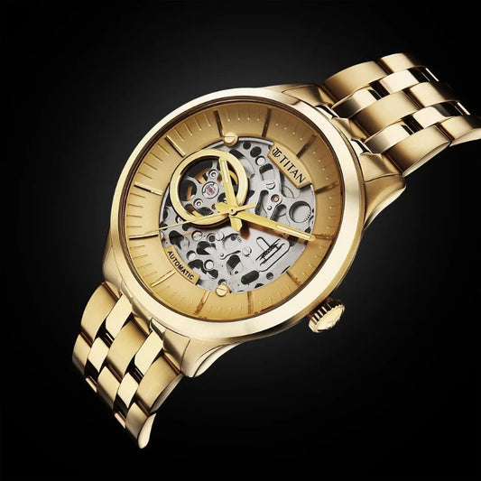 A graceful Titan women's watch with a champagne dial, gold-tone stainless steel strap, and a timeless analog design, perfect for both everyday elegance and special occasions.