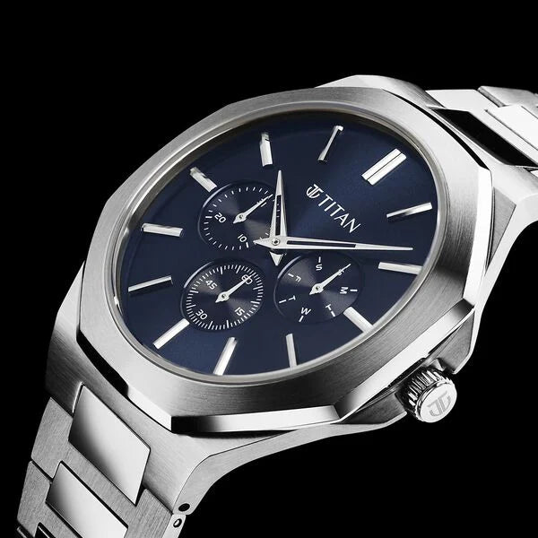 An elegant Titan women's watch with a silver-tone stainless steel strap, a sleek silver dial, and a timeless analog design, perfect for adding sophistication to any outfit.