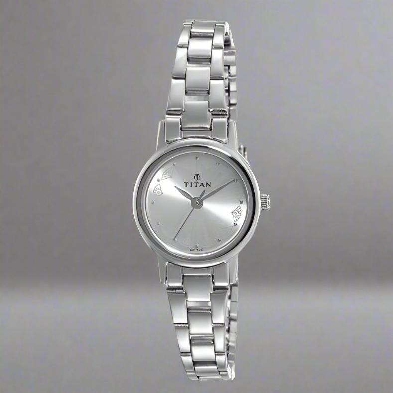 Buy Titan watch for ladies with TITAN 917SM03, featuring a sleek silver strap and elegant round dial for everyday elegance.
