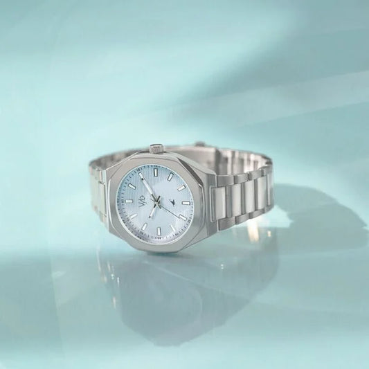 Silver watch on a light Elegant ladies watch FV30012SM01 by VYB Fastrack blue background