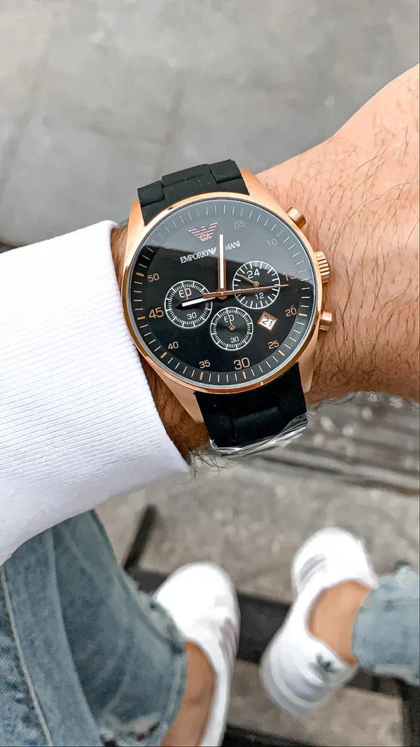 Wearing View Of Emporio Armani TAZIO Men Black Analogue Watch AR5905 with a black dial, chronograph features, and a silicon strap.